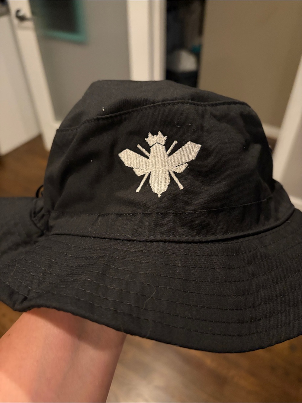 Black Bucket Hat with White Bee Logo